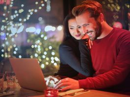 Couple looking at a laptop