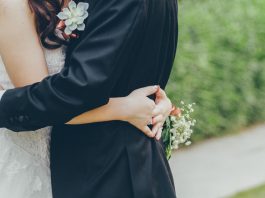 Holding hands at wedding