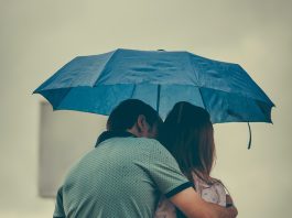 Photo by Shukhrat Umarov: https://www.pexels.com/photo/man-hugging-woman-while-holding-umbrella-1534633/