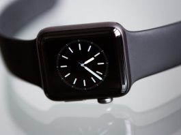 black apple watch with black sports band
