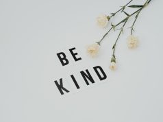 be kind lettering on white surface